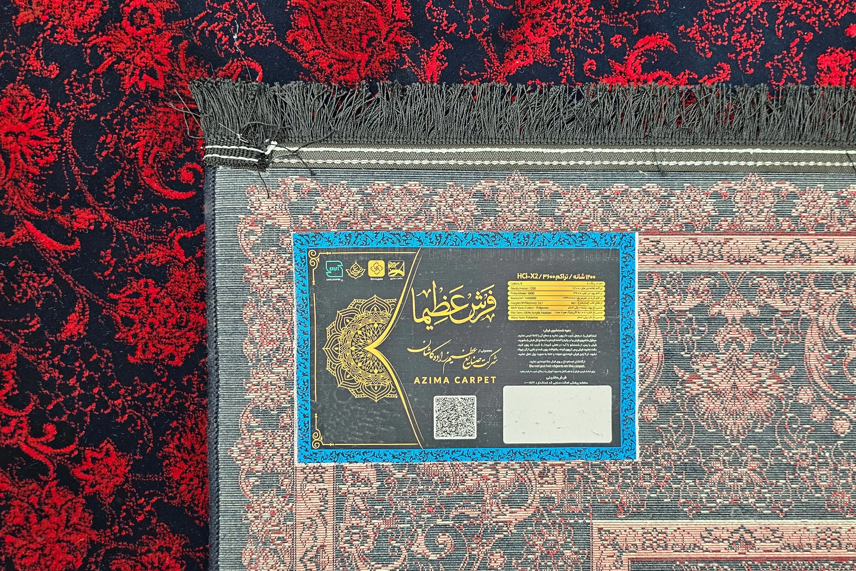 فرش 1200 شانه عظیم‌زاده، نقشه آنیتا سرمه ای لاکی با رنگ‌های گرم و بافت باکیفیت.